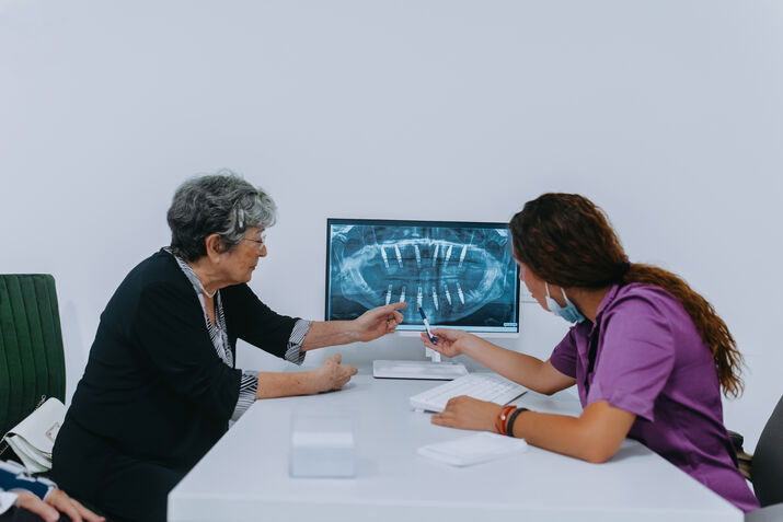 Dentist Reviewing and Explaining a Dental X-Ray