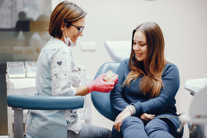 Doctor Explaining a Dental Procedure to a Patient